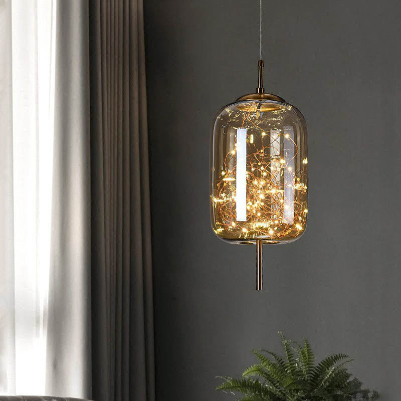Urokliwa skandynawska szklana lampa wisząca LED o ciepłym designie – dostępna w bursztynowym lub antracytowym wykończeniu